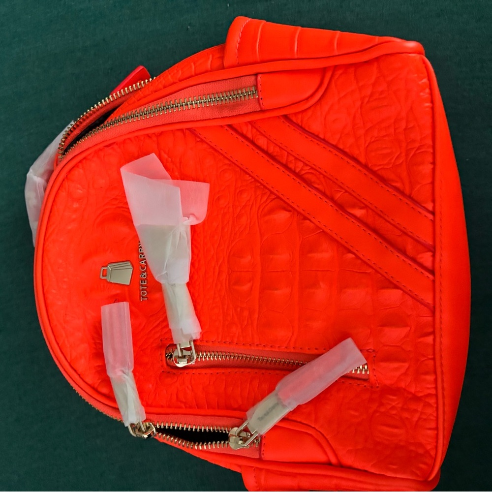 Vibrant Orange Textured Backpack by [Brand]